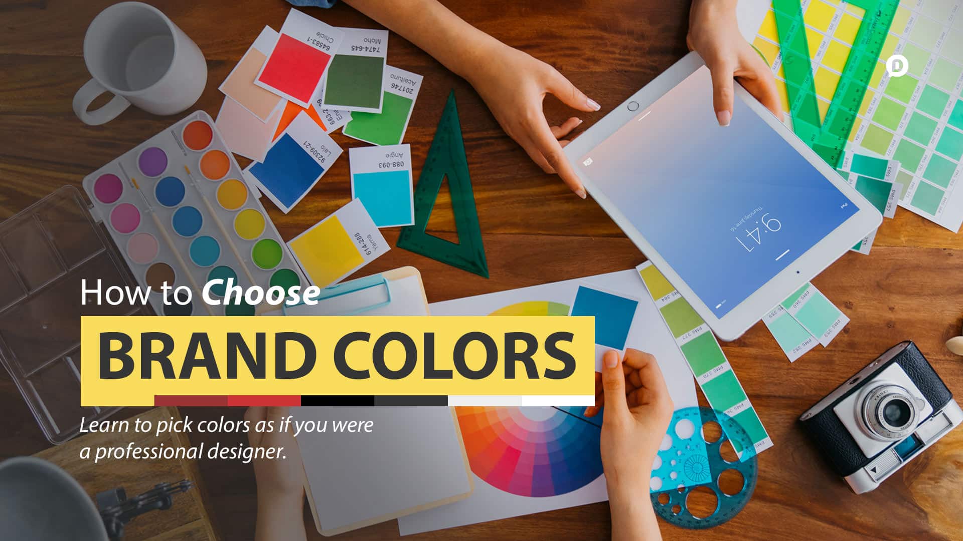 choose brand colors with paint samples all over a desk